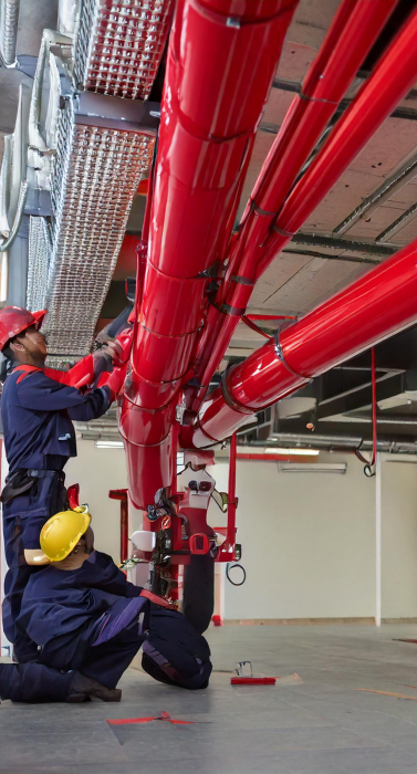 Firefly An ongoing fire pipeline installation in a commercial office space. Workers in safety gear a (3)
